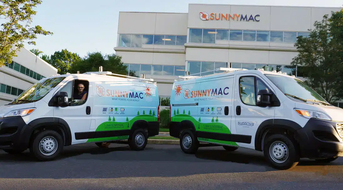 Two sunnymac vans parked in front of the sunnymac headquarters building