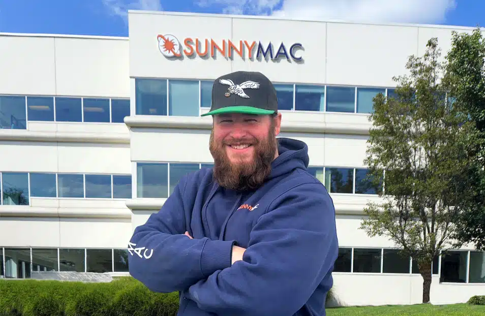 Mark standing in front of the sunnymac building
